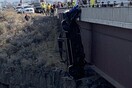 Couple rescued from truck hanging hundreds of feet over bridge