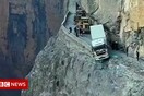 Truck spends three days dangling over China cliff