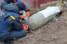 Brave Ukrainians defuse giant Russian bomb with two hands and bottle of water