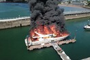 Superyacht sinks in Torquay harbour after large fire