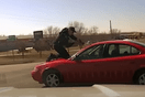 Iowa: Police officer clings to roof of car as suspect tries to escape