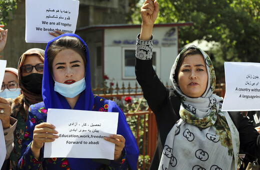 The Latest: Dozens march for women's rights at Kabul palace