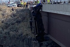 Couple rescued from truck hanging hundreds of feet over bridge