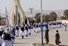 Taliban fighters march in uniforms on the street in Qalat, Zabul Province, Afghanistan,