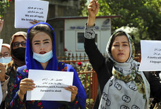 The Latest: Dozens march for women's rights at Kabul palace