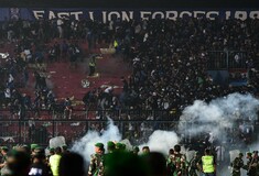 Indonesia football riot: 129 people killed after stampede at match