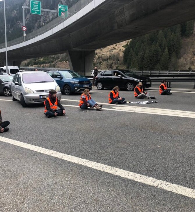 Ελβετία: Ακτιβιστές για το κλίμα απέκλεισαν κεντρικό δρόμο - Κόλλησαν στο οδόστρωμα
