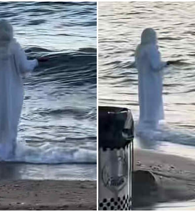 Βόλος: Viral στο TikTok βίντεο με γυναίκα ντυμένη στα λευκά που στέκεται όρθια σε παραλία