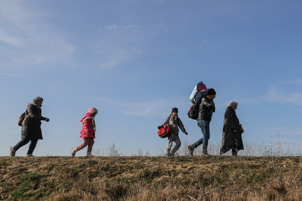 refugees walking