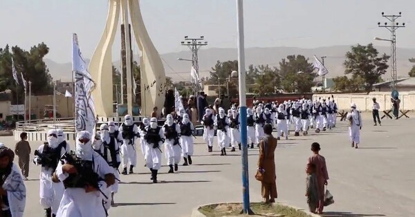 Taliban fighters march in uniforms on the street in Qalat, Zabul Province, Afghanistan,