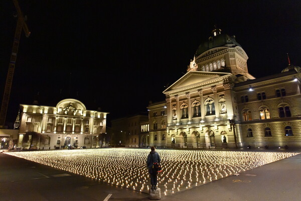 Swiss group lights 11,288 candles for COVID-19 victims