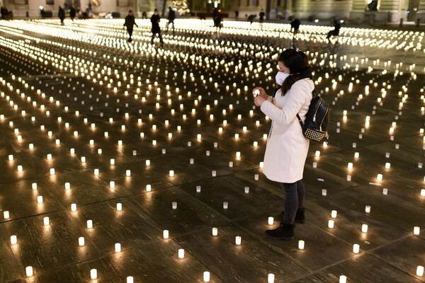 Swiss group lights 11,288 candles for COVID-19 victims