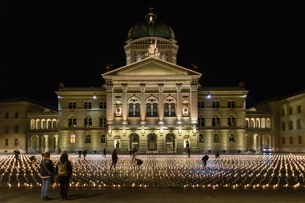 Swiss group lights 11,288 candles for COVID-19 victims