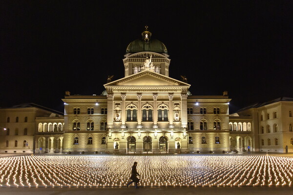 Swiss group lights 11,288 candles for COVID-19 victims