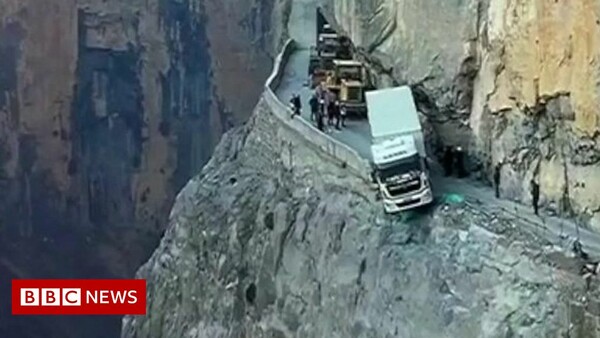 Truck spends three days dangling over China cliff