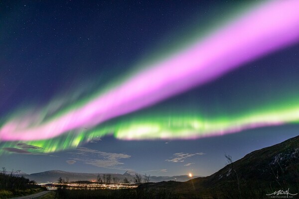 Solar Storm Causes Neon-Pink Northern Lights To Fill the Sky