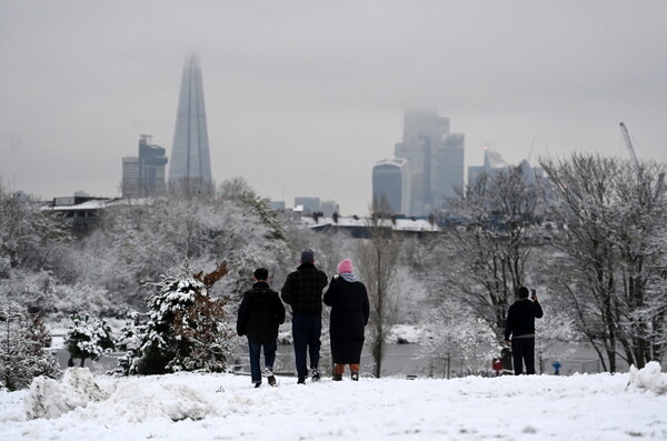Schools close and trains cancelled amid further warnings of snow and ice Updated