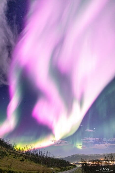 Solar Storm Causes Neon-Pink Northern Lights To Fill the Sky