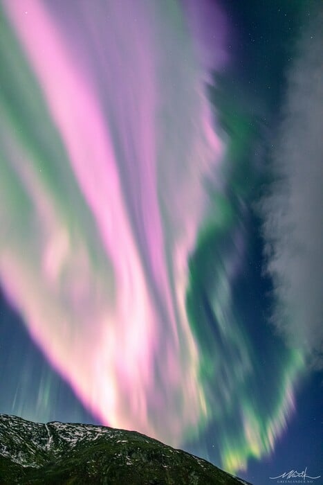 Solar Storm Causes Neon-Pink Northern Lights To Fill the Sky