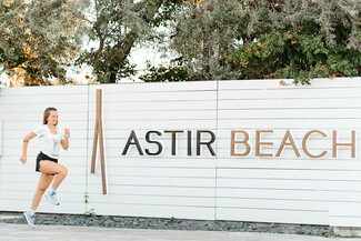 ladies run astir beach